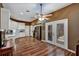 Bright eat-in kitchen with white cabinets, stainless steel appliances, and wood-look floors at 5305 Indian Ocean Loop, Tavares, FL 32778