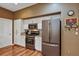 Modern kitchen with stainless steel appliances and white cabinetry at 5305 Indian Ocean Loop, Tavares, FL 32778