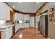 Modern kitchen with stainless steel appliances and white cabinetry at 5305 Indian Ocean Loop, Tavares, FL 32778