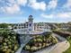 Community lighthouse featuring well-maintained gardens and winding pathways at 5305 Indian Ocean Loop, Tavares, FL 32778