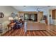 Spacious living room with hardwood floors and sliding doors to patio at 5305 Indian Ocean Loop, Tavares, FL 32778