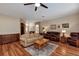 Comfortable living room with hardwood floors and a traditional decor style at 5305 Indian Ocean Loop, Tavares, FL 32778