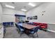 Conference room featuring a large wooden table, comfortable seating, and American flag décor at 5305 Indian Ocean Loop, Tavares, FL 32778