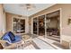 Screened patio with comfortable seating offering views of the backyard through large glass windows at 5305 Indian Ocean Loop, Tavares, FL 32778