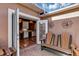 Cozy outdoor patio with bench seating, opens to a well-appointed kitchen featuring hardwood floors at 5305 Indian Ocean Loop, Tavares, FL 32778