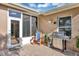 Outdoor patio area with grill, seating, and a door leading inside at 5305 Indian Ocean Loop, Tavares, FL 32778