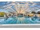 Indoor pool area showcasing a large pool with a geometric roof structure and surrounding lounge area at 5305 Indian Ocean Loop, Tavares, FL 32778
