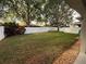 Spacious backyard, with large trees and a well-maintained lawn at 5548 Burlwood Dr, Orlando, FL 32810
