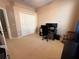 Bedroom with neutral walls and carpet flooring. Perfect for a home office! at 5548 Burlwood Dr, Orlando, FL 32810