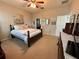 Warm bedroom featuring neutral colors, carpet, and traditional-style furnishings at 5548 Burlwood Dr, Orlando, FL 32810