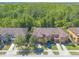Aerial view of a residential neighborhood with lush greenery and well-manicured lawns at 6078 Tivoli Gardens Blvd, Orlando, FL 32829