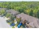 Aerial view of townhomes with tile roofs in a well-maintained community at 6078 Tivoli Gardens Blvd, Orlando, FL 32829