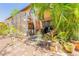 Landscaped backyard with a screened-in patio, ideal for outdoor living and entertaining at 6078 Tivoli Gardens Blvd, Orlando, FL 32829