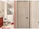Bright bathroom boasts a marble-tiled shower, cherry wood vanity, and a separate toilet area for privacy at 6078 Tivoli Gardens Blvd, Orlando, FL 32829
