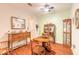 Cozy dining room features hardwood floors, ceiling fan, and wooden furnishings at 6078 Tivoli Gardens Blvd, Orlando, FL 32829