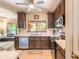 Modern kitchen with stainless appliances, white countertops, and dark cabinets at 6078 Tivoli Gardens Blvd, Orlando, FL 32829