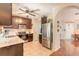 Well-equipped kitchen featuring stainless steel appliances and dark wood cabinets at 6078 Tivoli Gardens Blvd, Orlando, FL 32829