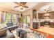 Inviting living room with a ceiling fan, leather furniture, and sliding glass doors to the outside at 6078 Tivoli Gardens Blvd, Orlando, FL 32829