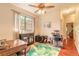 Bright office space with cat tree, a desk, large window with natural lighting, and wood flooring at 6078 Tivoli Gardens Blvd, Orlando, FL 32829