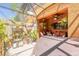 Relaxing patio with hot tub, tropical plants, and cozy seating area at 6078 Tivoli Gardens Blvd, Orlando, FL 32829