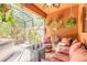 Relaxing outdoor patio with comfortable seating, plants, and a ceiling fan at 6078 Tivoli Gardens Blvd, Orlando, FL 32829