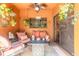 Cozy patio with comfortable seating, an outdoor rug, and decorative plants at 6078 Tivoli Gardens Blvd, Orlando, FL 32829