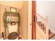 Compact powder room with toilet, shelf, and partial view of wooden stairs at 6078 Tivoli Gardens Blvd, Orlando, FL 32829