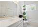 Bright bathroom with a patterned shower curtain and white fixtures, providing a clean and playful atmosphere at 6111 Oxbow Bend Ln, Port Orange, FL 32128