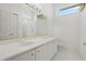 Well-lit bathroom featuring double sinks and vanity, offering both functionality and style at 6111 Oxbow Bend Ln, Port Orange, FL 32128