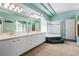 Bright bathroom features dual sinks, soaking tub, shower, and glass block window providing natural light at 6111 Oxbow Bend Ln, Port Orange, FL 32128