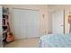 Bedroom featuring closet with bi-fold doors, and doorway leading to another room at 6111 Oxbow Bend Ln, Port Orange, FL 32128