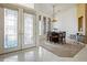 Elegant dining room with a chandelier, table with six chairs and tiled flooring at 6111 Oxbow Bend Ln, Port Orange, FL 32128