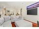 Bright living room with a large TV, comfortable seating, and kitchen view at 6111 Oxbow Bend Ln, Port Orange, FL 32128