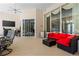Spacious covered patio with comfortable seating, a mini fridge, and access to the pool area at 6111 Oxbow Bend Ln, Port Orange, FL 32128