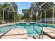 Inviting screened pool area with a jacuzzi and ample space for leisure and entertaining at 6111 Oxbow Bend Ln, Port Orange, FL 32128