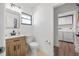 Bathroom including sink and toilet next to a laundry room with a washer and dryer at 6247 Palomino Cir, Port Orange, FL 32127