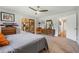 Large bedroom showcasing carpet flooring, neutral walls, wood accents, and view into another room at 6247 Palomino Cir, Port Orange, FL 32127