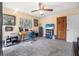 Bedroom features a wooden desk, rolling chair, large window, TV and a ceiling fan at 6247 Palomino Cir, Port Orange, FL 32127