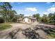 Charming home with brick accents, two car garage, and spacious driveway at 6247 Palomino Cir, Port Orange, FL 32127