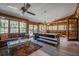 Spacious game room with abundant natural light, a billiard table, and access to the outdoor area, perfect for entertainment at 6247 Palomino Cir, Port Orange, FL 32127
