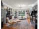 A spacious living room featuring unique decor, including a Star Wars Boba Fett statue and arcade games at 6247 Palomino Cir, Port Orange, FL 32127