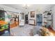 This living room showcases models and collectibles, with an open view into the adjacent kitchen at 6247 Palomino Cir, Port Orange, FL 32127