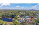 House with a lovely backyard deck and greenhouse near a picturesque pond at 630 Florida Ave, Daytona Beach, FL 32117