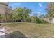 Large backyard area with an old wooden fence and some small trees at 630 Florida Ave, Daytona Beach, FL 32117