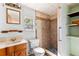 Bathroom featuring a tiled shower and vanity, offering functionality and classic style at 630 Florida Ave, Daytona Beach, FL 32117