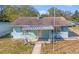 Charming home featuring a covered porch with unique architectural metal work and light blue siding at 630 Florida Ave, Daytona Beach, FL 32117