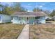 Charming one-story home with a welcoming front porch and well-kept lawn at 630 Florida Ave, Daytona Beach, FL 32117
