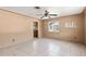 Bright living room with tile flooring, a ceiling fan, and views of the outside at 630 Florida Ave, Daytona Beach, FL 32117