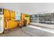 Enclosed back patio with a water heater, utility sink, concrete floor, and open access to a yard at 630 Florida Ave, Daytona Beach, FL 32117