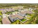 Community aerial view showcasing residential homes, green spaces, and nearby ponds at 7068 Lanier Falls Rd, Deland, FL 32724